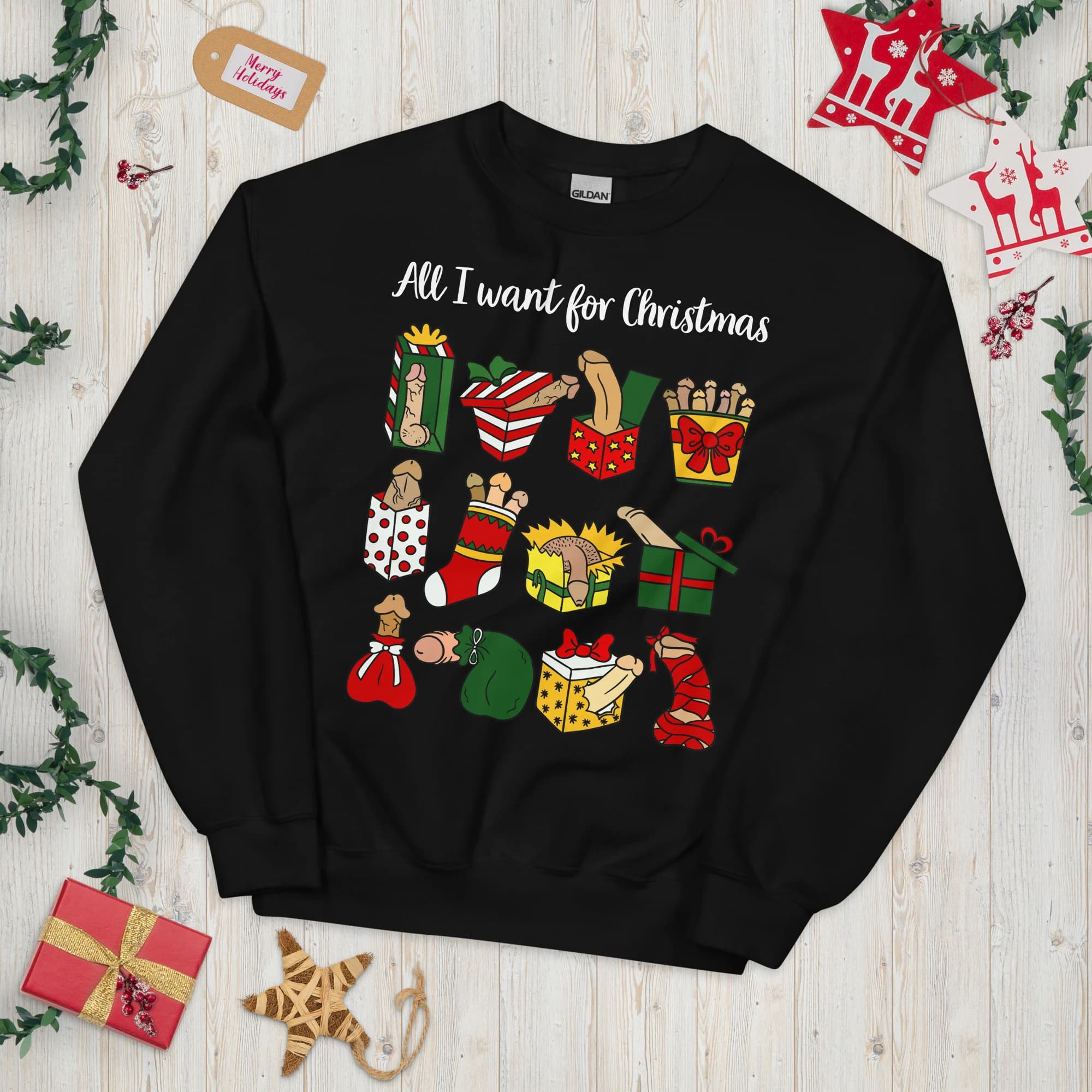 Black crewneck sweatshirt laid flat with illustrated naughty penis-themed Christmas gifts and sample All I want for Christmas text.