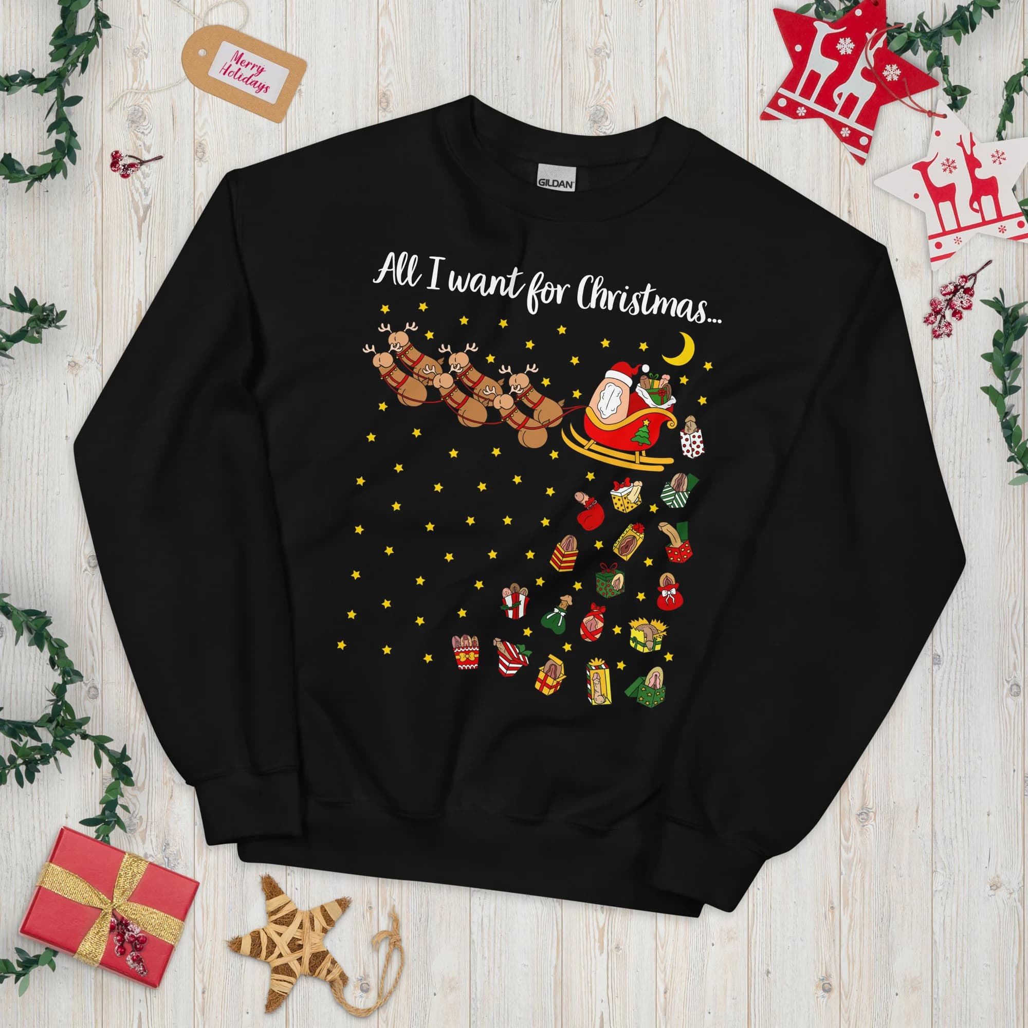 Black unisex Christmas sweatshirt featuring Santa and reindeer above a trail of vulva-themed Christmas gifts, stars and a crescent moon. Wording shown is a customizable example.