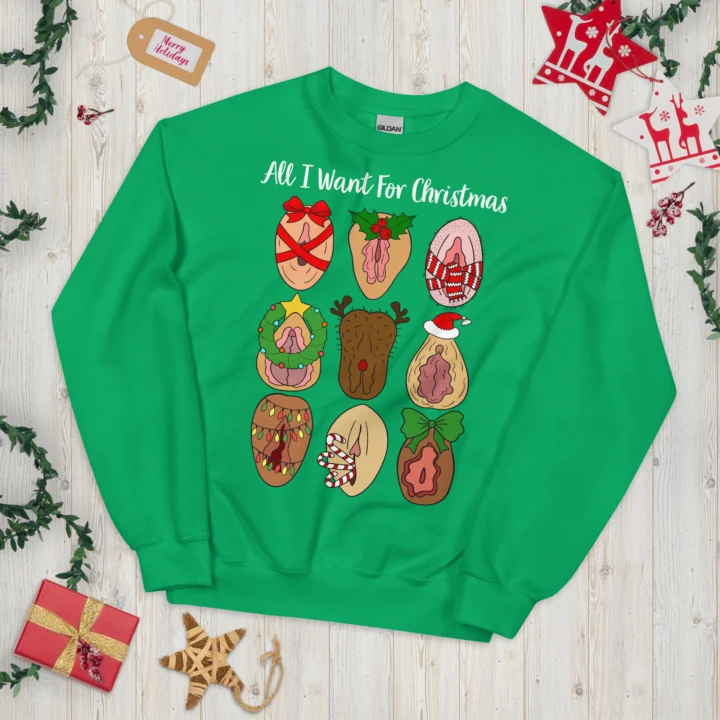 Irish Green crewneck sweatshirt laid flat with festive vulva illustrations, ribbons, holly and sample 'All I Want For Christmas' text.